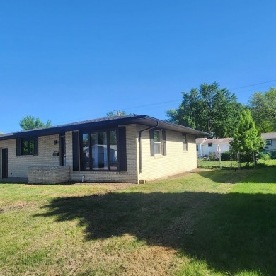 Discover comfort and convenience in this charming brick ranch on Hillcrest Golf and Country Club in South Dakota - for sale on GolfHomes.com, golf home, golf lot