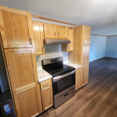 Discover comfort and convenience in this charming brick ranch on Hillcrest Golf and Country Club in South Dakota - for sale on GolfHomes.com, golf home, golf lot