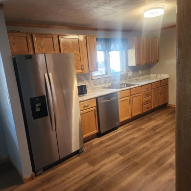 Discover comfort and convenience in this charming brick ranch on Hillcrest Golf and Country Club in South Dakota - for sale on GolfHomes.com, golf home, golf lot
