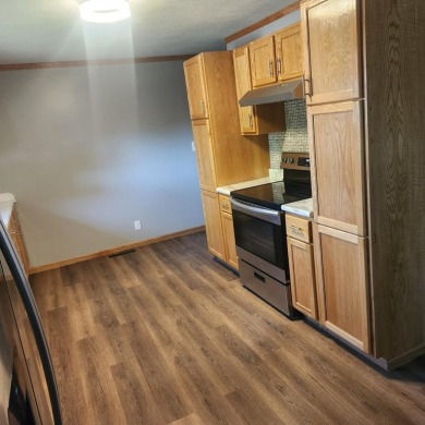 Discover comfort and convenience in this charming brick ranch on Hillcrest Golf and Country Club in South Dakota - for sale on GolfHomes.com, golf home, golf lot