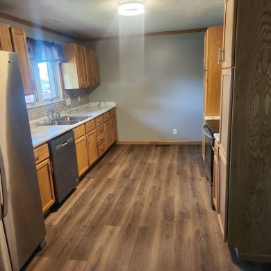 Discover comfort and convenience in this charming brick ranch on Hillcrest Golf and Country Club in South Dakota - for sale on GolfHomes.com, golf home, golf lot
