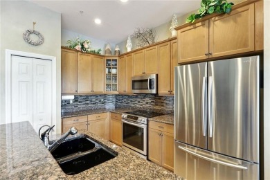 Stunning Designer Condo with Expansive Lake Views in the Heart on Pelican Sound Golf and River Club in Florida - for sale on GolfHomes.com, golf home, golf lot