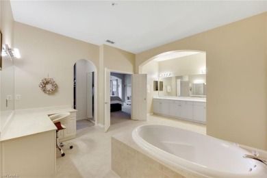 Stunning Designer Condo with Expansive Lake Views in the Heart on Pelican Sound Golf and River Club in Florida - for sale on GolfHomes.com, golf home, golf lot