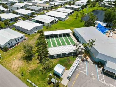 Welcome to a refined slice of paradise in the prestigious on Twin Isles Country Club in Florida - for sale on GolfHomes.com, golf home, golf lot