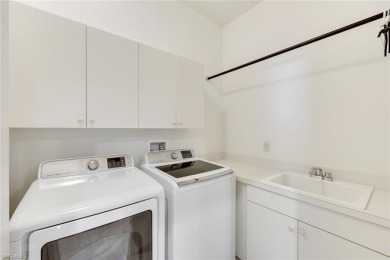 Stunning Designer Condo with Expansive Lake Views in the Heart on Pelican Sound Golf and River Club in Florida - for sale on GolfHomes.com, golf home, golf lot