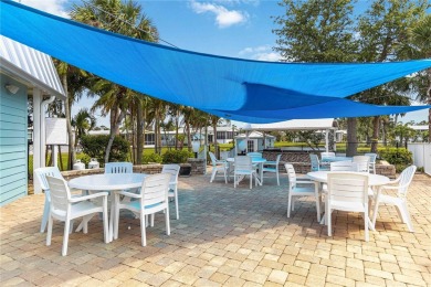 Welcome to a refined slice of paradise in the prestigious on Twin Isles Country Club in Florida - for sale on GolfHomes.com, golf home, golf lot