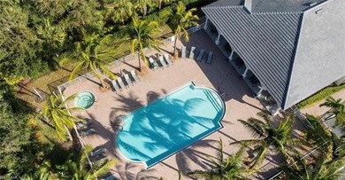 Stunning Designer Condo with Expansive Lake Views in the Heart on Pelican Sound Golf and River Club in Florida - for sale on GolfHomes.com, golf home, golf lot