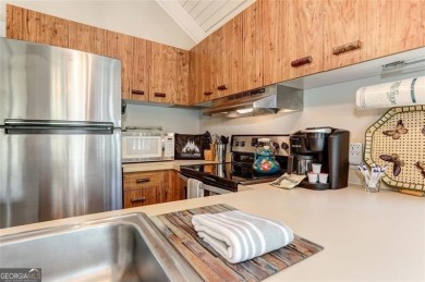 This spectacular villa offers seasonal views of Lake Petit and on Big Canoe Golf Club - Cherokee in Georgia - for sale on GolfHomes.com, golf home, golf lot