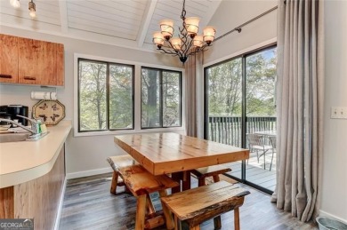 This spectacular villa offers seasonal views of Lake Petit and on Big Canoe Golf Club - Cherokee in Georgia - for sale on GolfHomes.com, golf home, golf lot