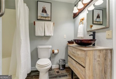 This spectacular villa offers seasonal views of Lake Petit and on Big Canoe Golf Club - Cherokee in Georgia - for sale on GolfHomes.com, golf home, golf lot