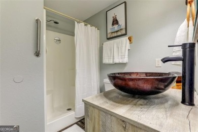 This spectacular villa offers seasonal views of Lake Petit and on Big Canoe Golf Club - Cherokee in Georgia - for sale on GolfHomes.com, golf home, golf lot