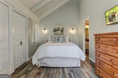 This spectacular villa offers seasonal views of Lake Petit and on Big Canoe Golf Club - Cherokee in Georgia - for sale on GolfHomes.com, golf home, golf lot