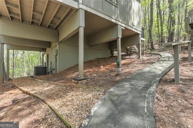 This spectacular villa offers seasonal views of Lake Petit and on Big Canoe Golf Club - Cherokee in Georgia - for sale on GolfHomes.com, golf home, golf lot