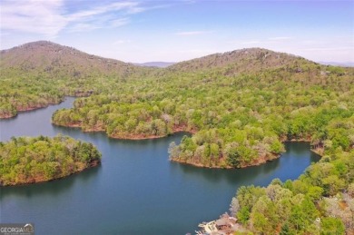 This spectacular villa offers seasonal views of Lake Petit and on Big Canoe Golf Club - Cherokee in Georgia - for sale on GolfHomes.com, golf home, golf lot