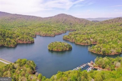 This spectacular villa offers seasonal views of Lake Petit and on Big Canoe Golf Club - Cherokee in Georgia - for sale on GolfHomes.com, golf home, golf lot
