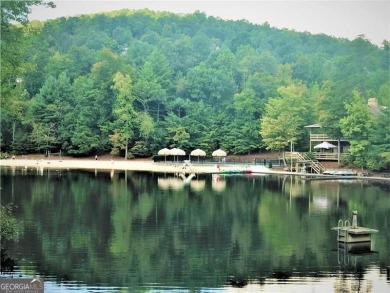 This spectacular villa offers seasonal views of Lake Petit and on Big Canoe Golf Club - Cherokee in Georgia - for sale on GolfHomes.com, golf home, golf lot