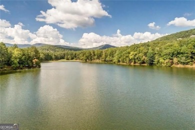 This spectacular villa offers seasonal views of Lake Petit and on Big Canoe Golf Club - Cherokee in Georgia - for sale on GolfHomes.com, golf home, golf lot