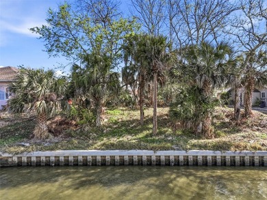 Start with the water. Build the rest.

This 80 by 125 foot on Palm Harbor Golf Club in Florida - for sale on GolfHomes.com, golf home, golf lot