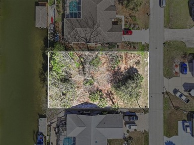 Start with the water. Build the rest.

This 80 by 125 foot on Palm Harbor Golf Club in Florida - for sale on GolfHomes.com, golf home, golf lot