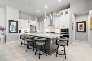 SHOWCASE HOME W/A WATER VIEW IN PGI! Check out this exceptional on Saint Andrews South Golf Club in Florida - for sale on GolfHomes.com, golf home, golf lot