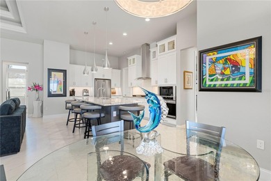 SHOWCASE HOME W/A WATER VIEW IN PGI! Check out this exceptional on Saint Andrews South Golf Club in Florida - for sale on GolfHomes.com, golf home, golf lot