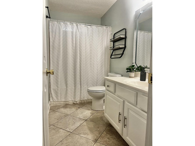 Well-maintained, all-brick 4-bedroom, 2-bath home located in the on Rocky Bayou Country Club in Florida - for sale on GolfHomes.com, golf home, golf lot