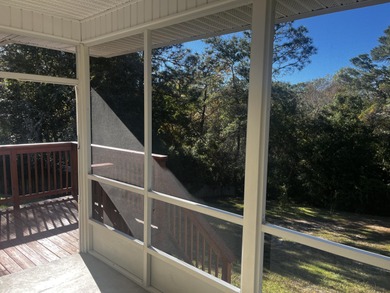 Well-maintained, all-brick 4-bedroom, 2-bath home located in the on Rocky Bayou Country Club in Florida - for sale on GolfHomes.com, golf home, golf lot