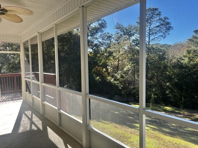 Well-maintained, all-brick 4-bedroom, 2-bath home located in the on Rocky Bayou Country Club in Florida - for sale on GolfHomes.com, golf home, golf lot