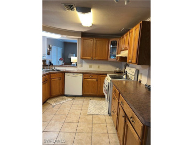 Welcome to Tamiami Village! Location is Great! Rare corner lot on Six Lakes Country Club in Florida - for sale on GolfHomes.com, golf home, golf lot