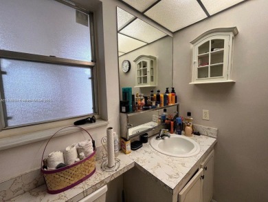 Immerse yourself in the carefree charm of this delightful 1-bed on Sunrise Country Club in Florida - for sale on GolfHomes.com, golf home, golf lot