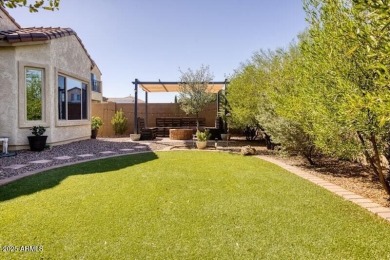This beautiful 2,706-sqft home features an open floor plan with on Poston Butte Golf Club in Arizona - for sale on GolfHomes.com, golf home, golf lot