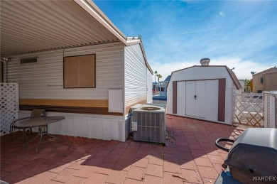 Corner Lot Retreat with Deck and Spacious Bonus Room in on Riverview Golf Course in Arizona - for sale on GolfHomes.com, golf home, golf lot