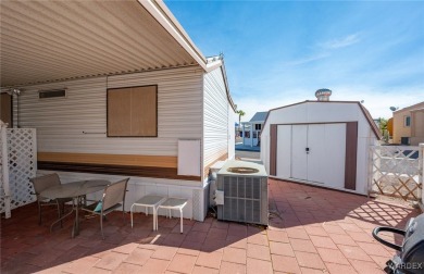 Corner Lot Retreat with Deck and Spacious Bonus Room in on Riverview Golf Course in Arizona - for sale on GolfHomes.com, golf home, golf lot