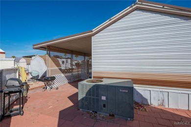 Corner Lot Retreat with Deck and Spacious Bonus Room in on Riverview Golf Course in Arizona - for sale on GolfHomes.com, golf home, golf lot