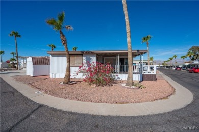 Corner Lot Retreat with Deck and Spacious Bonus Room in on Riverview Golf Course in Arizona - for sale on GolfHomes.com, golf home, golf lot