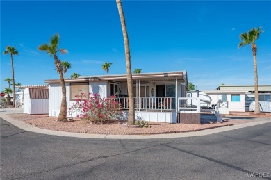 Corner Lot Retreat with Deck and Spacious Bonus Room in on Riverview Golf Course in Arizona - for sale on GolfHomes.com, golf home, golf lot