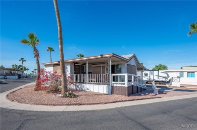 Corner Lot Retreat with Deck and Spacious Bonus Room in on Riverview Golf Course in Arizona - for sale on GolfHomes.com, golf home, golf lot