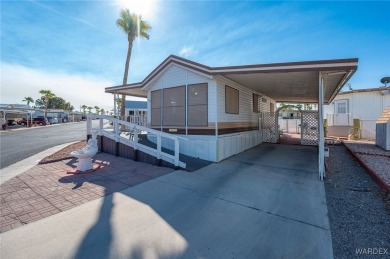 Corner Lot Retreat with Deck and Spacious Bonus Room in on Riverview Golf Course in Arizona - for sale on GolfHomes.com, golf home, golf lot