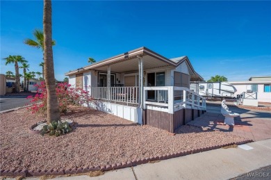 Corner Lot Retreat with Deck and Spacious Bonus Room in on Riverview Golf Course in Arizona - for sale on GolfHomes.com, golf home, golf lot