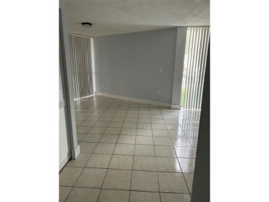 This  a   2 bedroom  2 bath condo  unit located on the  first on Country Club of Miami in Florida - for sale on GolfHomes.com, golf home, golf lot