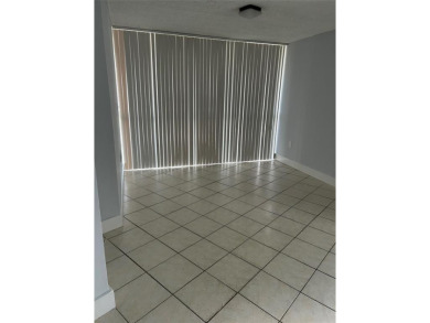 This  a   2 bedroom  2 bath condo  unit located on the  first on Country Club of Miami in Florida - for sale on GolfHomes.com, golf home, golf lot