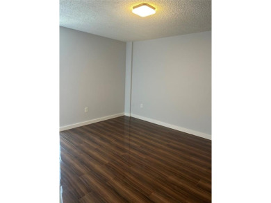 This  a   2 bedroom  2 bath condo  unit located on the  first on Country Club of Miami in Florida - for sale on GolfHomes.com, golf home, golf lot