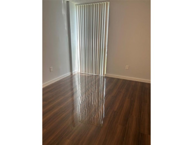 This  a   2 bedroom  2 bath condo  unit located on the  first on Country Club of Miami in Florida - for sale on GolfHomes.com, golf home, golf lot