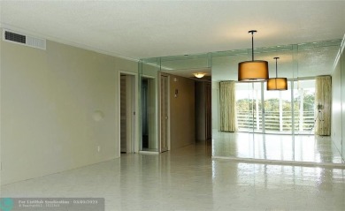 HUGE PRICE REDUCTION! This 5th-floor condo offers 1,500 square on Palm-Aire Country Club and Resort - The Oaks in Florida - for sale on GolfHomes.com, golf home, golf lot