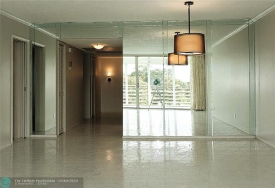 HUGE PRICE REDUCTION! This 5th-floor condo offers 1,500 square on Palm-Aire Country Club and Resort - The Oaks in Florida - for sale on GolfHomes.com, golf home, golf lot