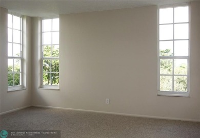 HUGE PRICE REDUCTION! This 5th-floor condo offers 1,500 square on Palm-Aire Country Club and Resort - The Oaks in Florida - for sale on GolfHomes.com, golf home, golf lot