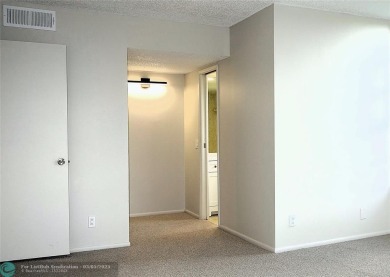 HUGE PRICE REDUCTION! This 5th-floor condo offers 1,500 square on Palm-Aire Country Club and Resort - The Oaks in Florida - for sale on GolfHomes.com, golf home, golf lot
