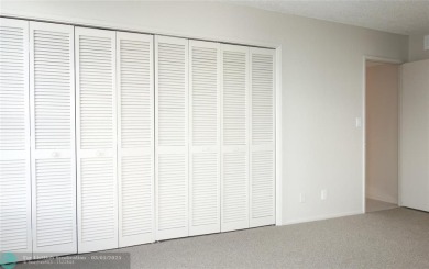 HUGE PRICE REDUCTION! This 5th-floor condo offers 1,500 square on Palm-Aire Country Club and Resort - The Oaks in Florida - for sale on GolfHomes.com, golf home, golf lot