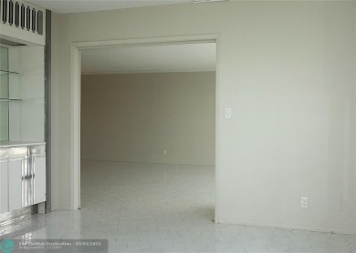 HUGE PRICE REDUCTION! This 5th-floor condo offers 1,500 square on Palm-Aire Country Club and Resort - The Oaks in Florida - for sale on GolfHomes.com, golf home, golf lot