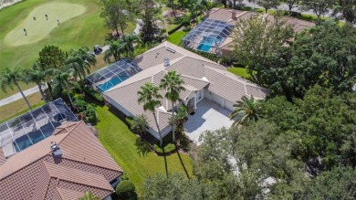 Exceptional home located on the 14th green of the Fazio designed on Hunters Green Country Club in Florida - for sale on GolfHomes.com, golf home, golf lot